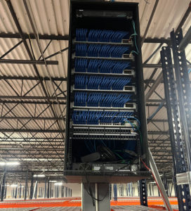 Fully patched and organized Intermediate Distribution Frame (IDF) with labeled network connections - CommX Networks